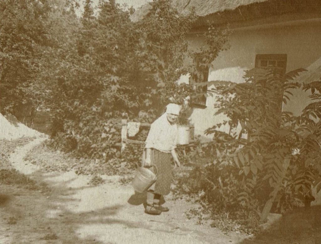 Mother of Nikolai in front of their home in the Ukraine