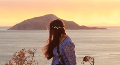A member from In Albis Teatro looks at the horizon in Cape Sounion in Greece