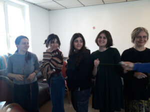 International team having fun while doing the strings' activity during the workshop in Berlin