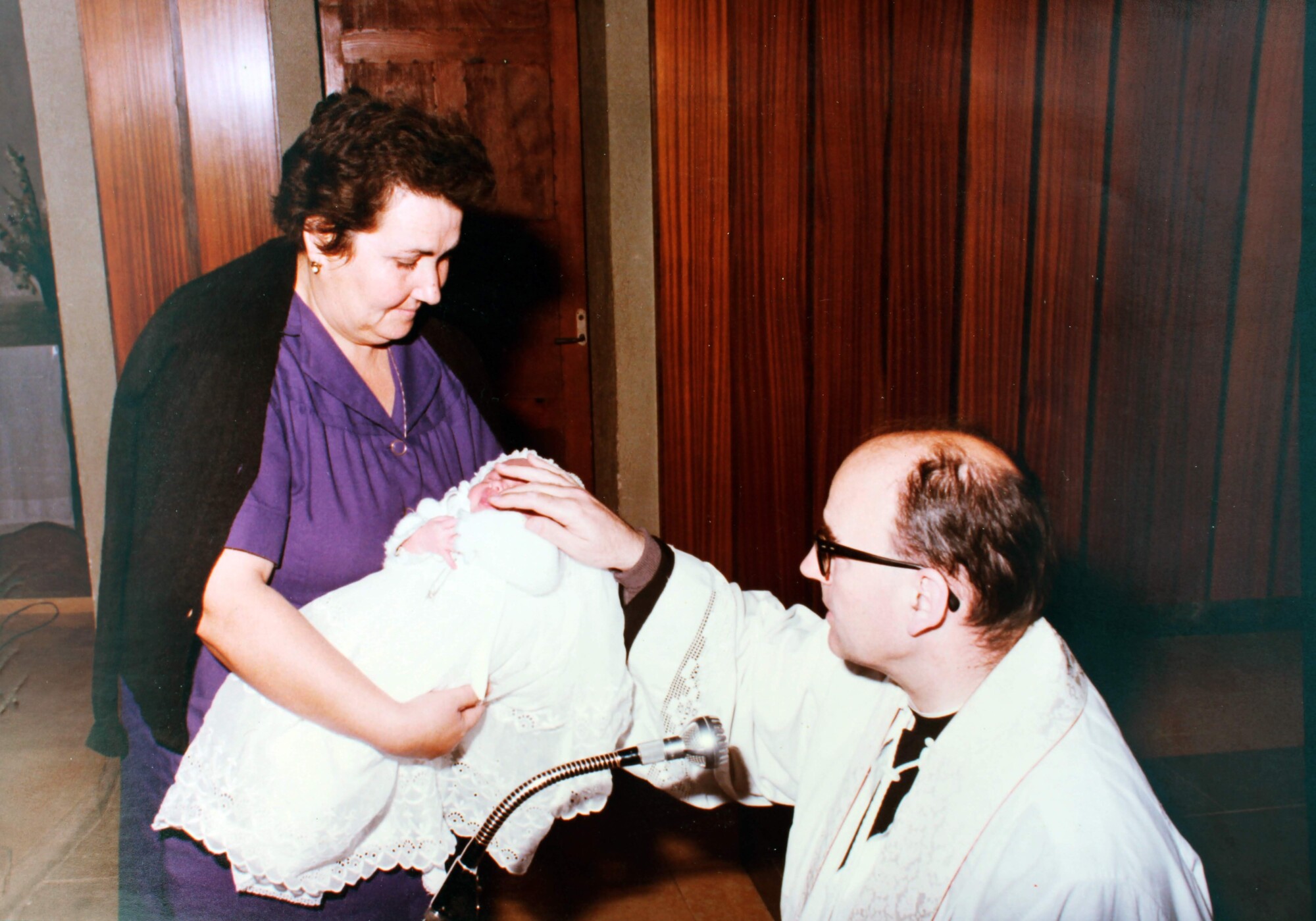 My grandmother in the baptism of her grandson with the Priest (Photo: Private)